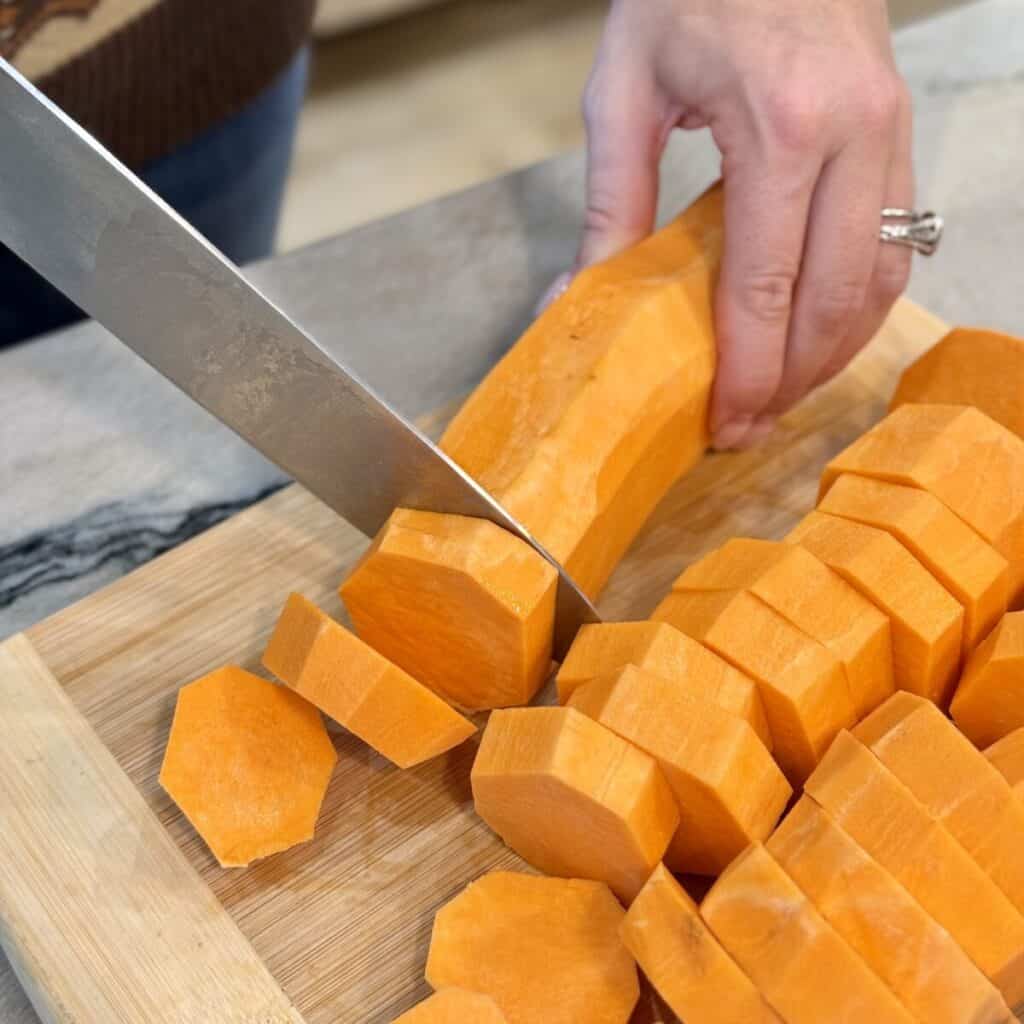 Peeling and slicing sweet potatoes.