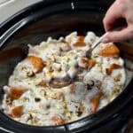 A crockpot full of crockpot sweet potato casserole.
