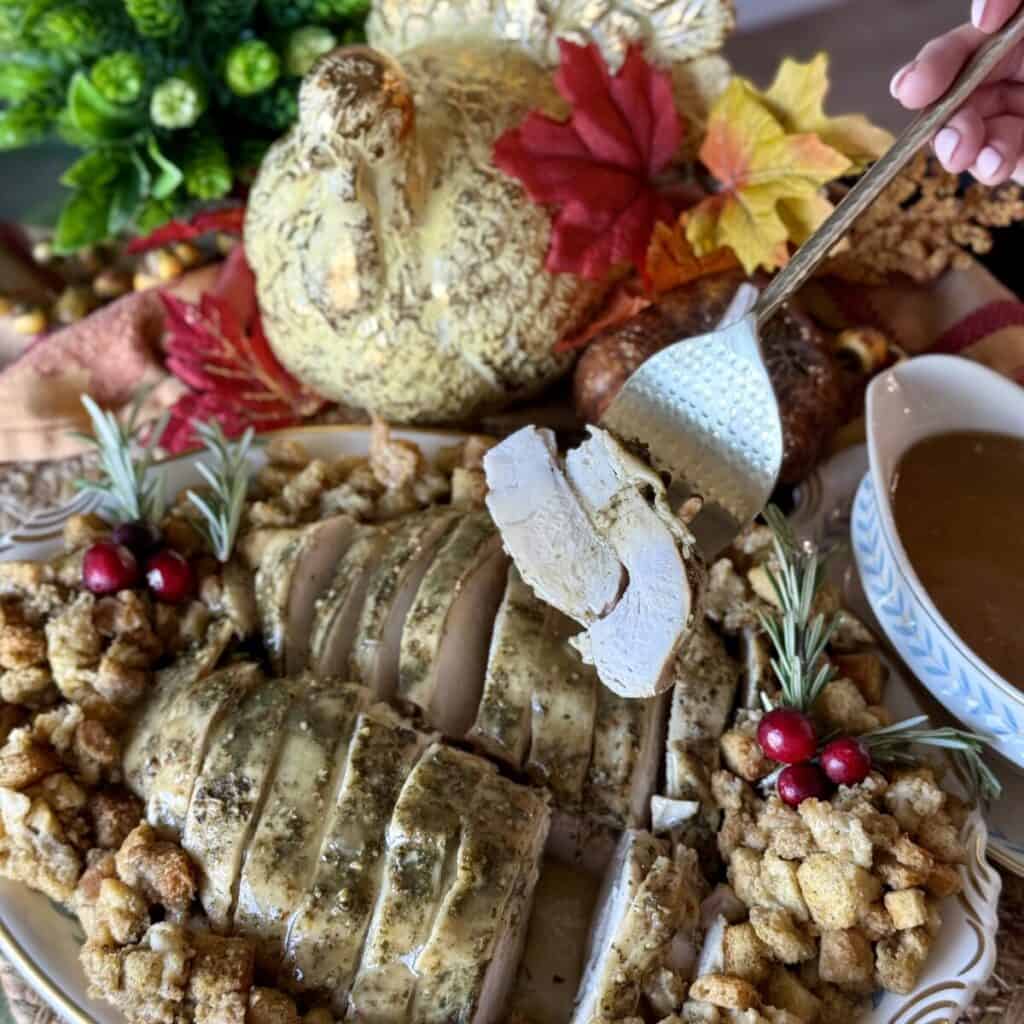 Serving turkey breast on a platter.