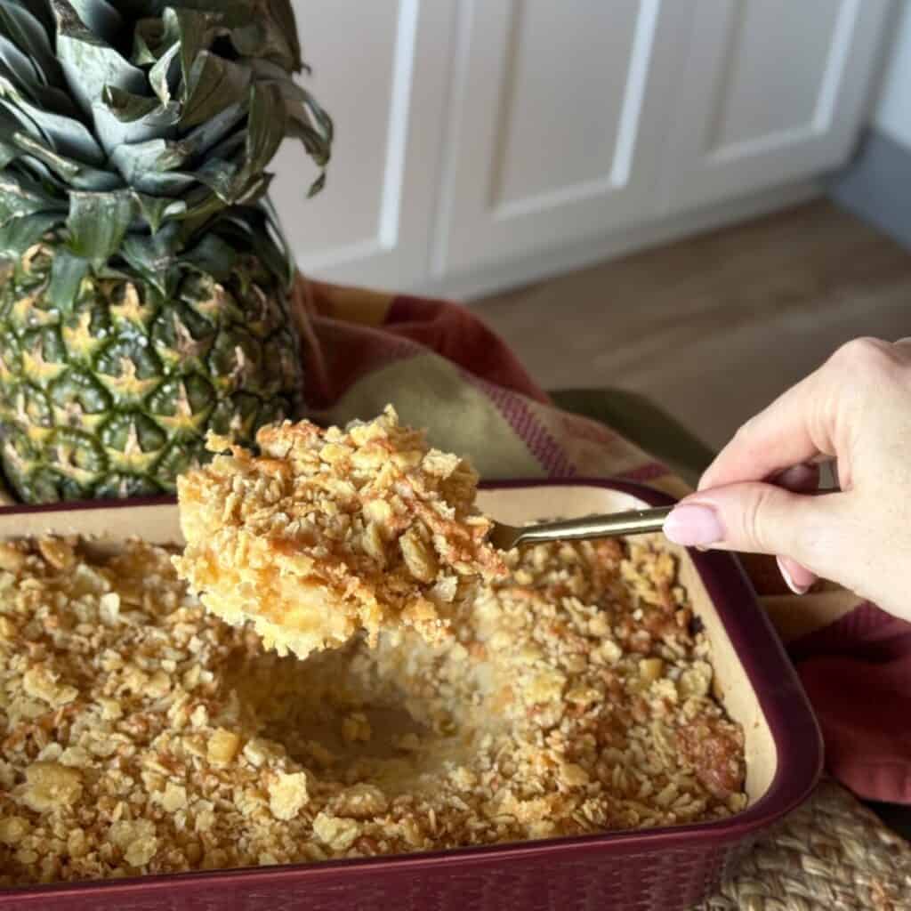 A spoonful of pineapple casserole recipe.