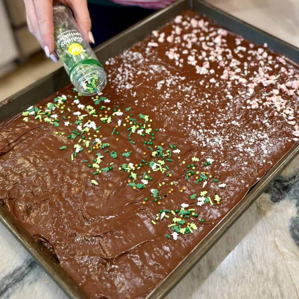 Adding toppings to toffee.