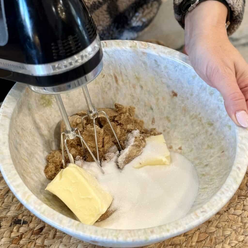 Mixing the ingredients in a bowl for peanut Butter Cup Cookies.