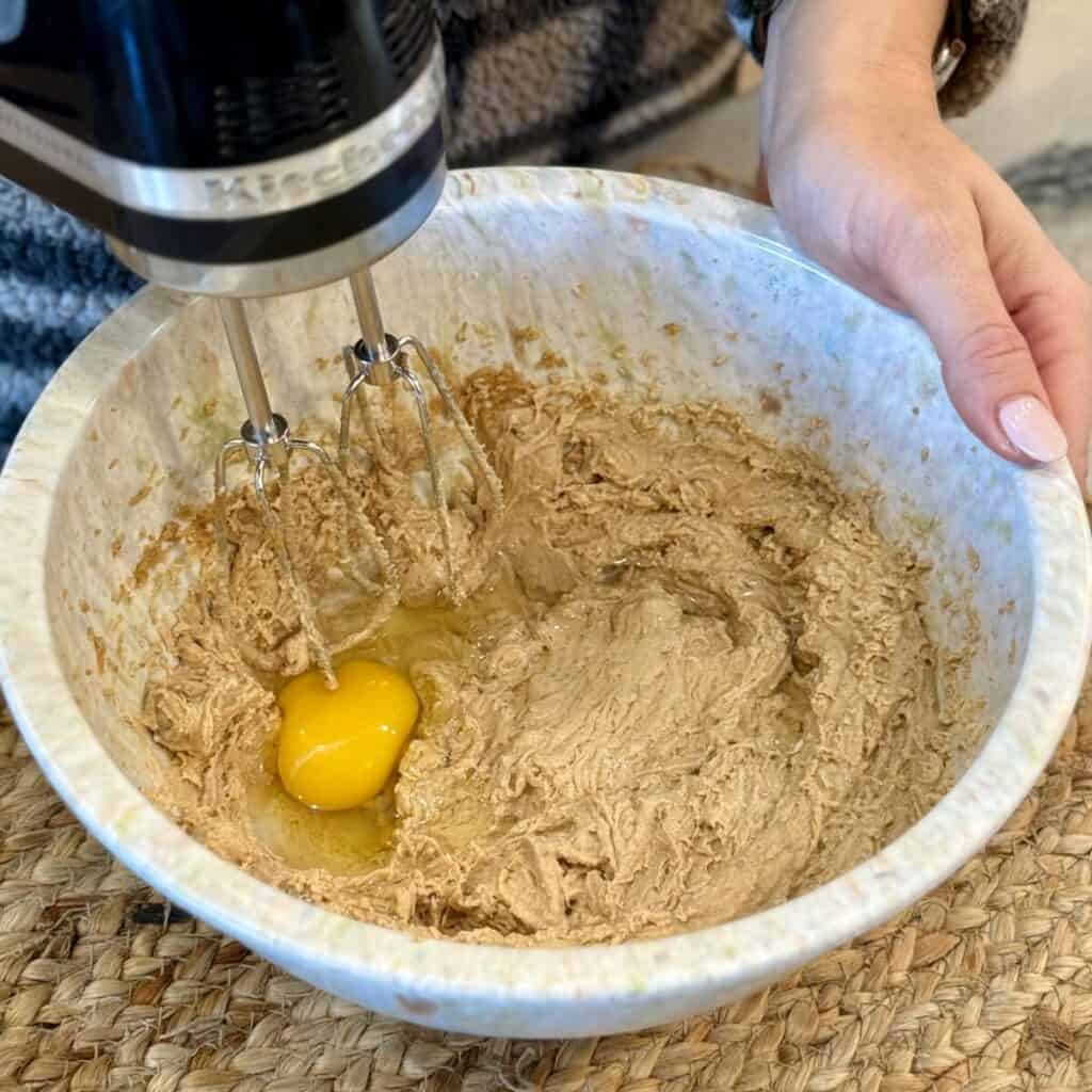 Mixing the ingredients in a bowl for peanut Butter Cup Cookies.
