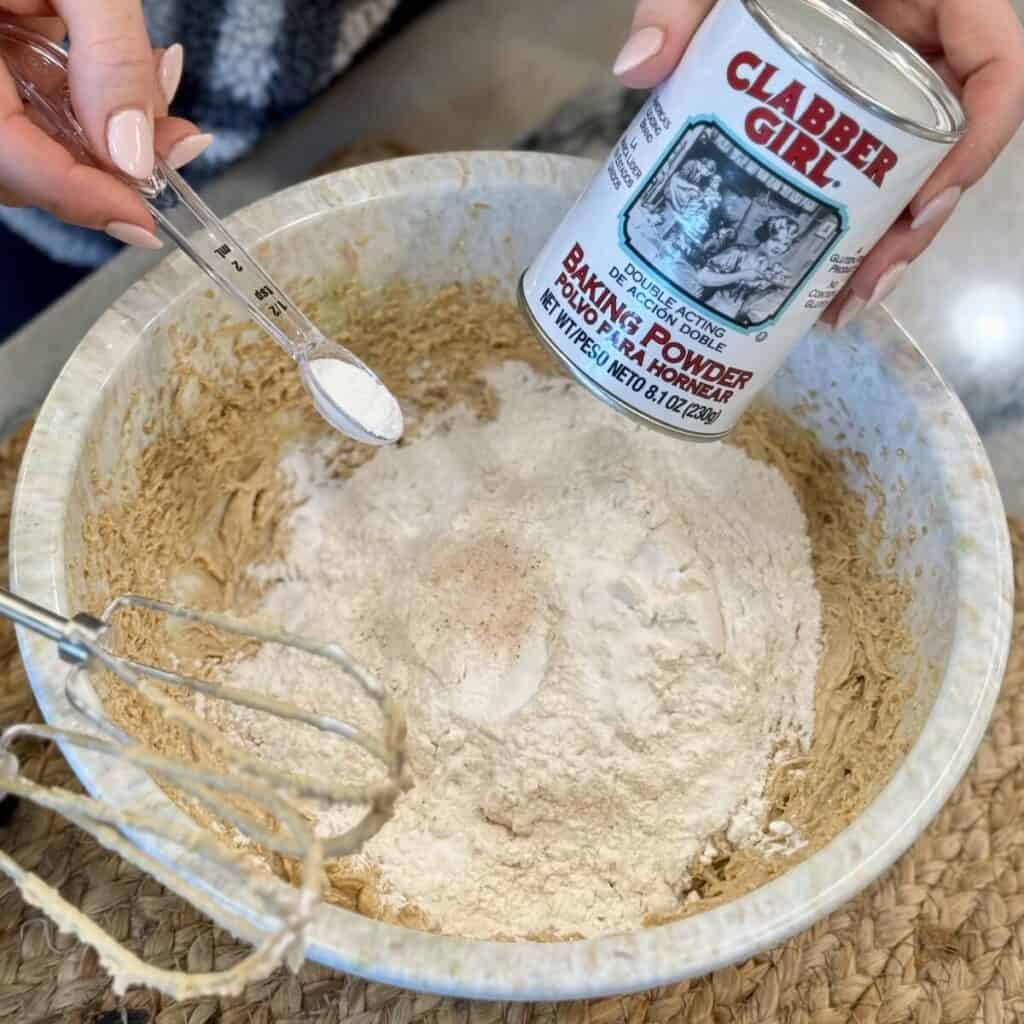 Mixing the ingredients in a bowl for peanut Butter Cup Cookies.