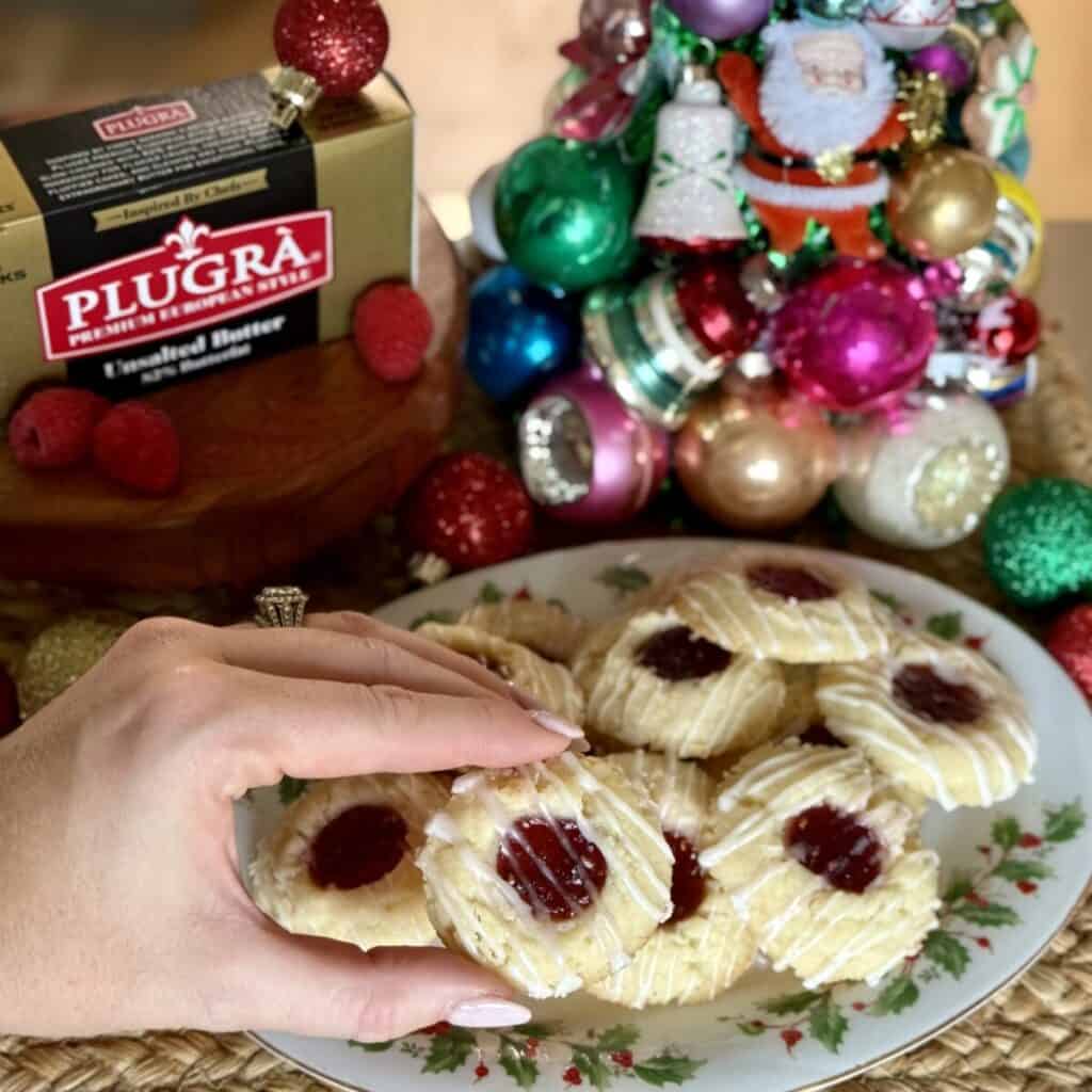 A plate of raspberry thumbprint cookies.