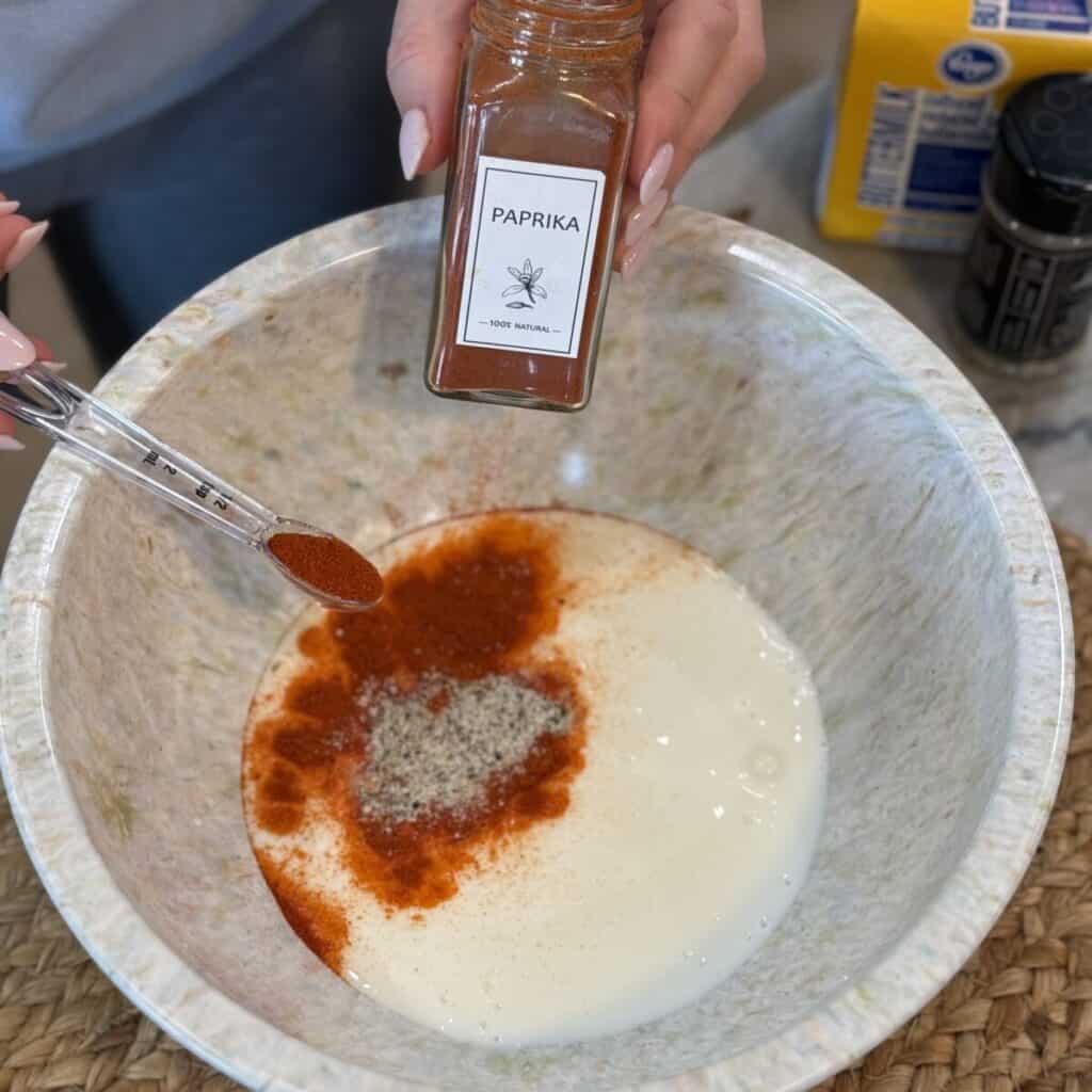 The batter in a bowl for cornflake chicken tenders.