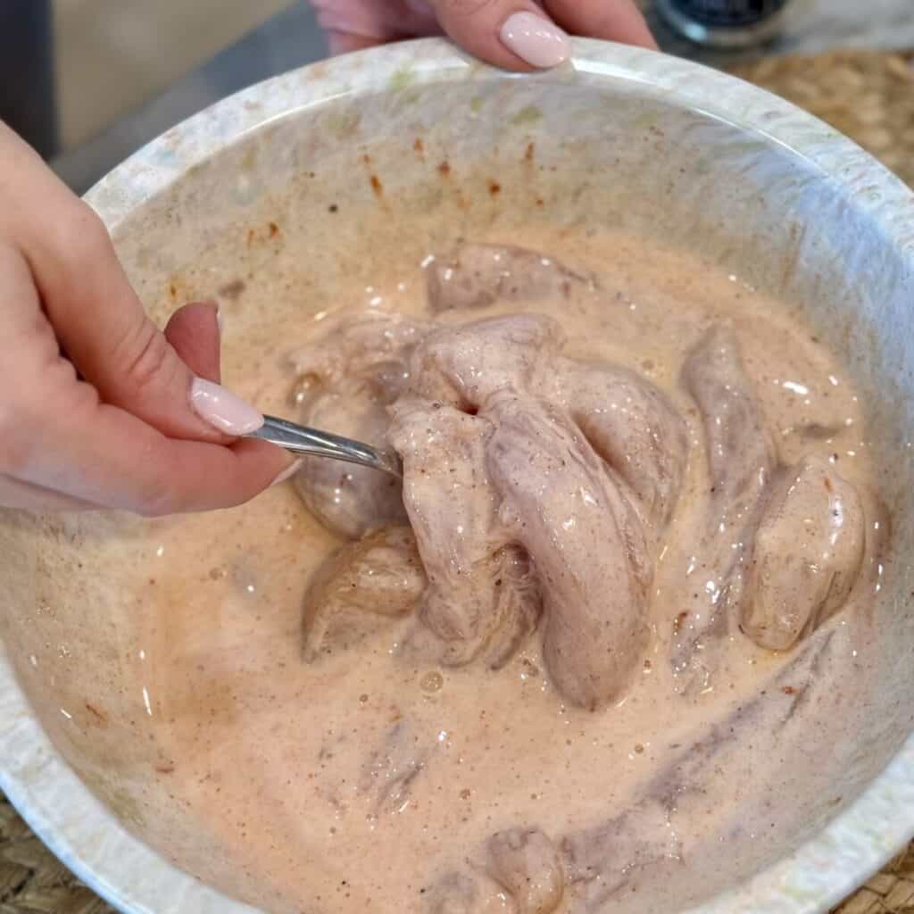 The batter in a bowl for cornflake chicken tenders.