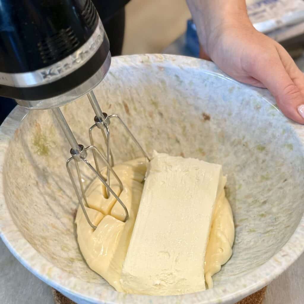 Mixing the ingredients in a bowl for million dollar dip.