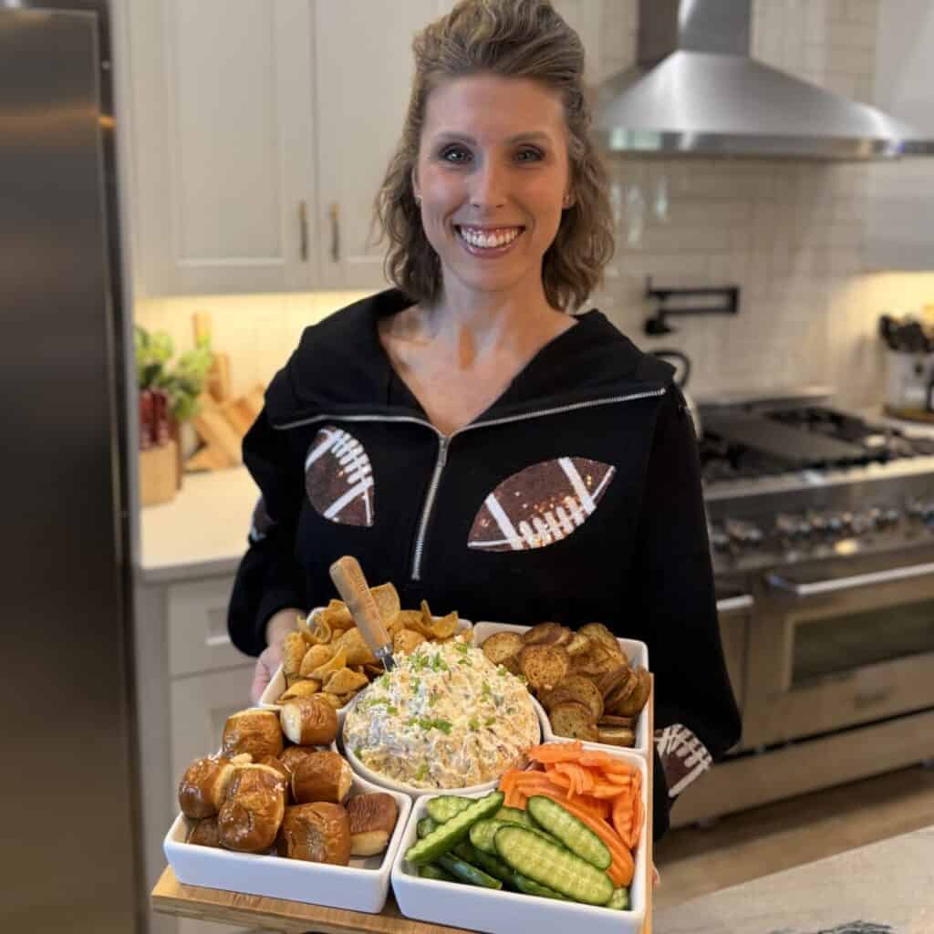 Laura Johnson holding a tray of million dollar dip and dippers.