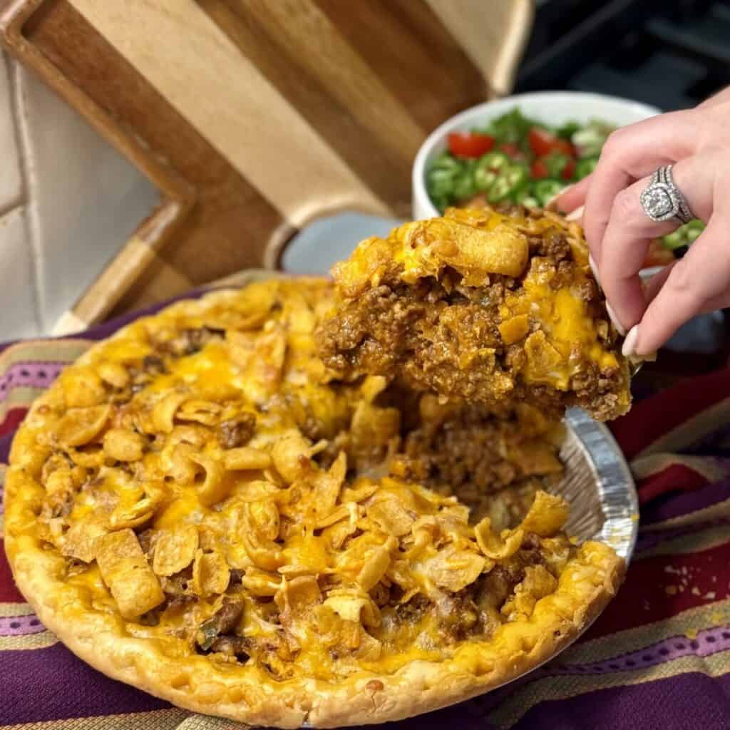 Getting a slice of taco pie.
