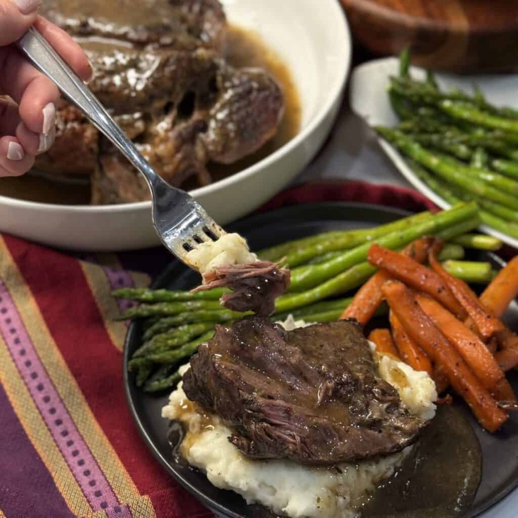 Oven pot roast with asparagus, carrots, and mashed potatoes.