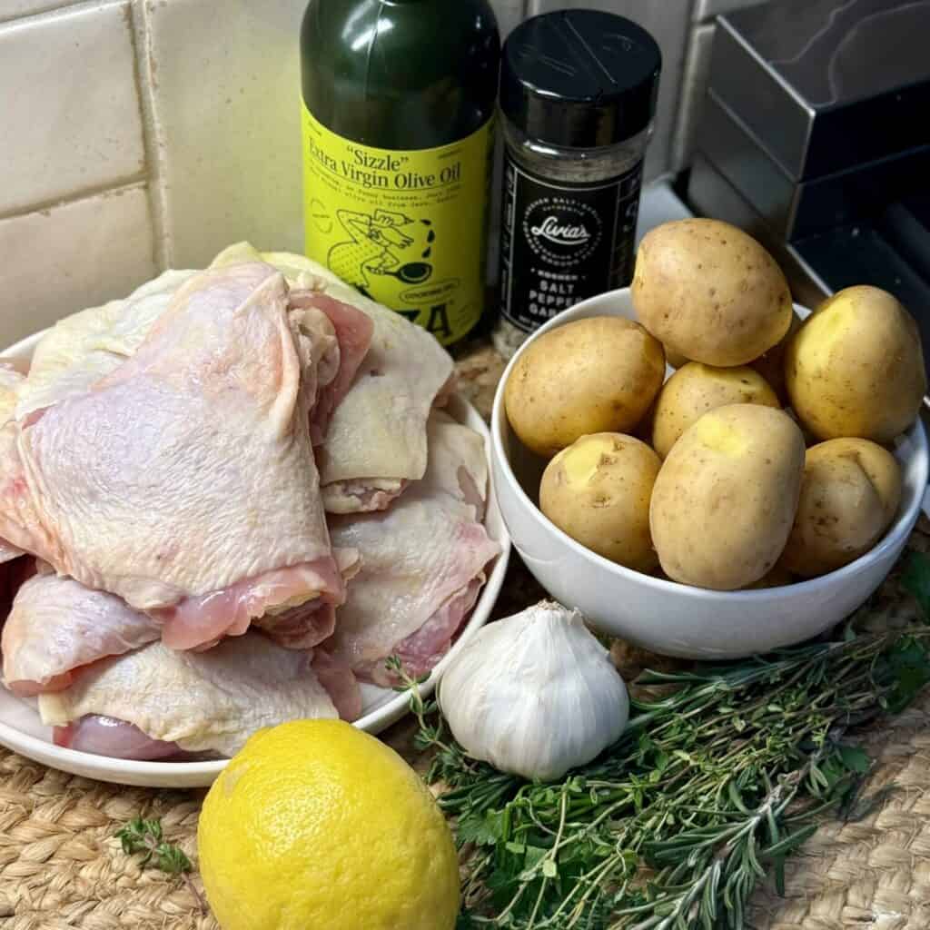 The ingredients to make roasted chicken thighs and potatoes.