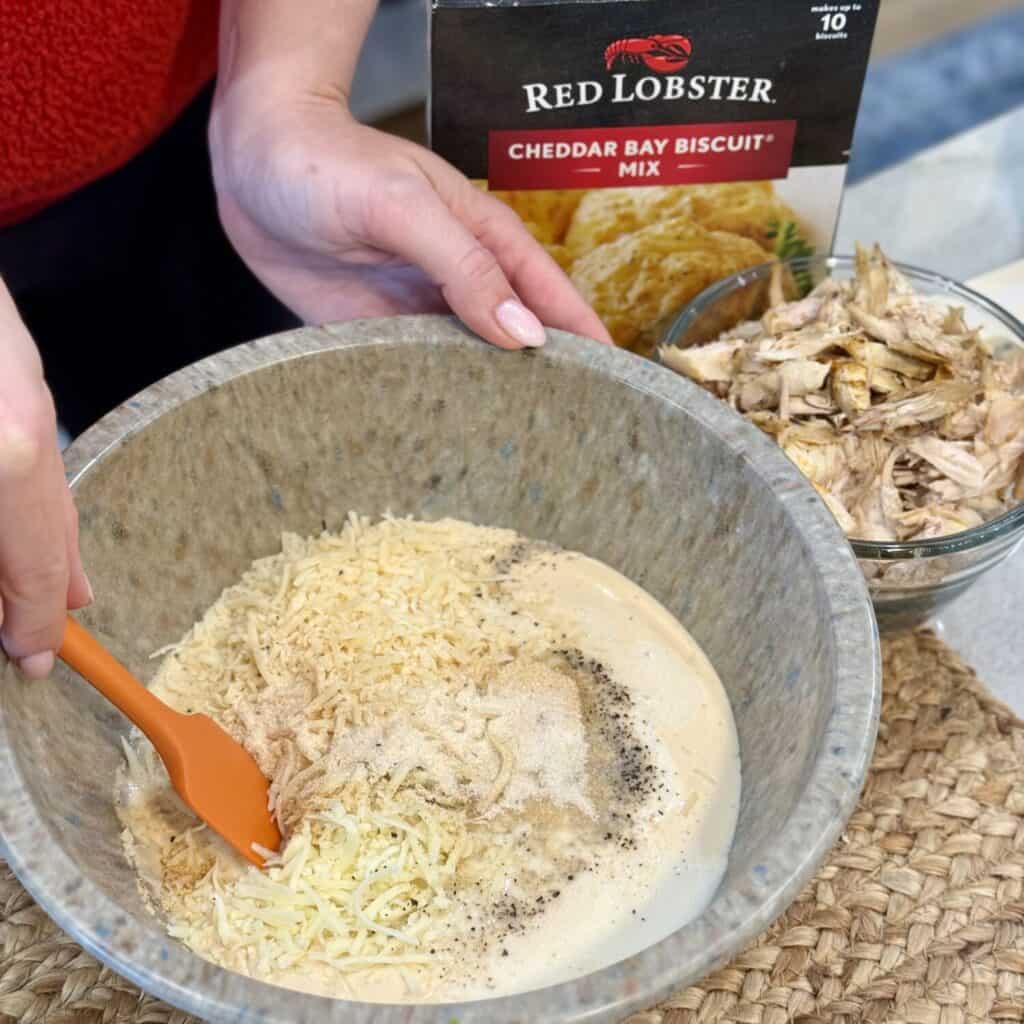 Making the filling for chicken and biscuit casserole.