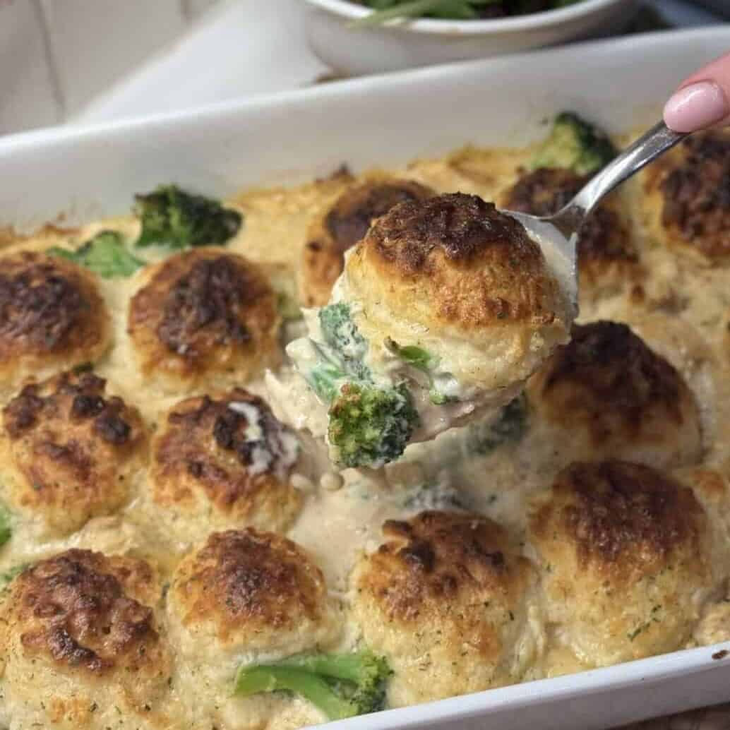 A spoon of chicken and biscuit casserole.