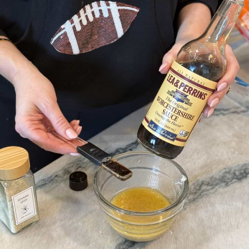 Making a butter sauce for Philly cheesesteak sliders.