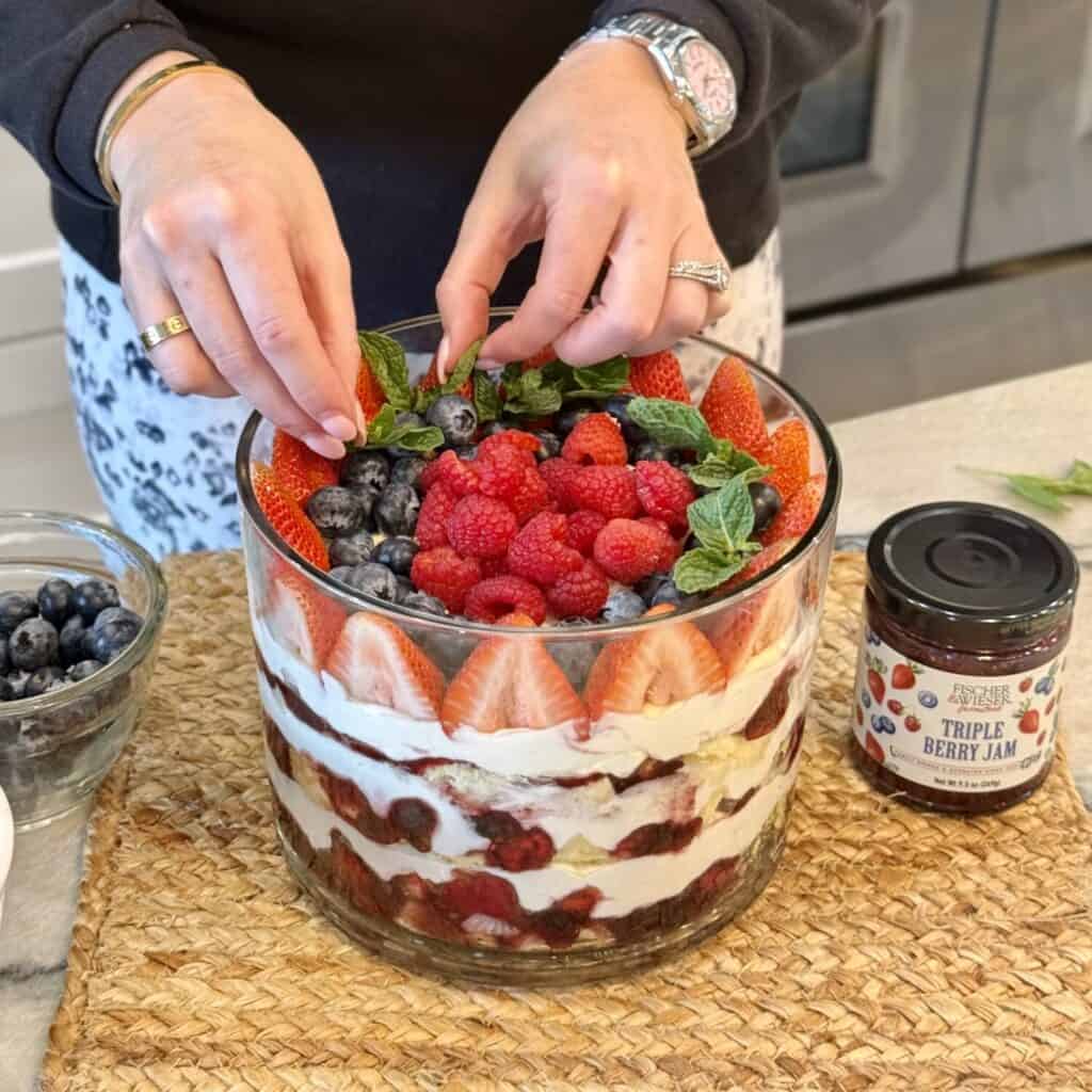 Assembling a berry trifle.