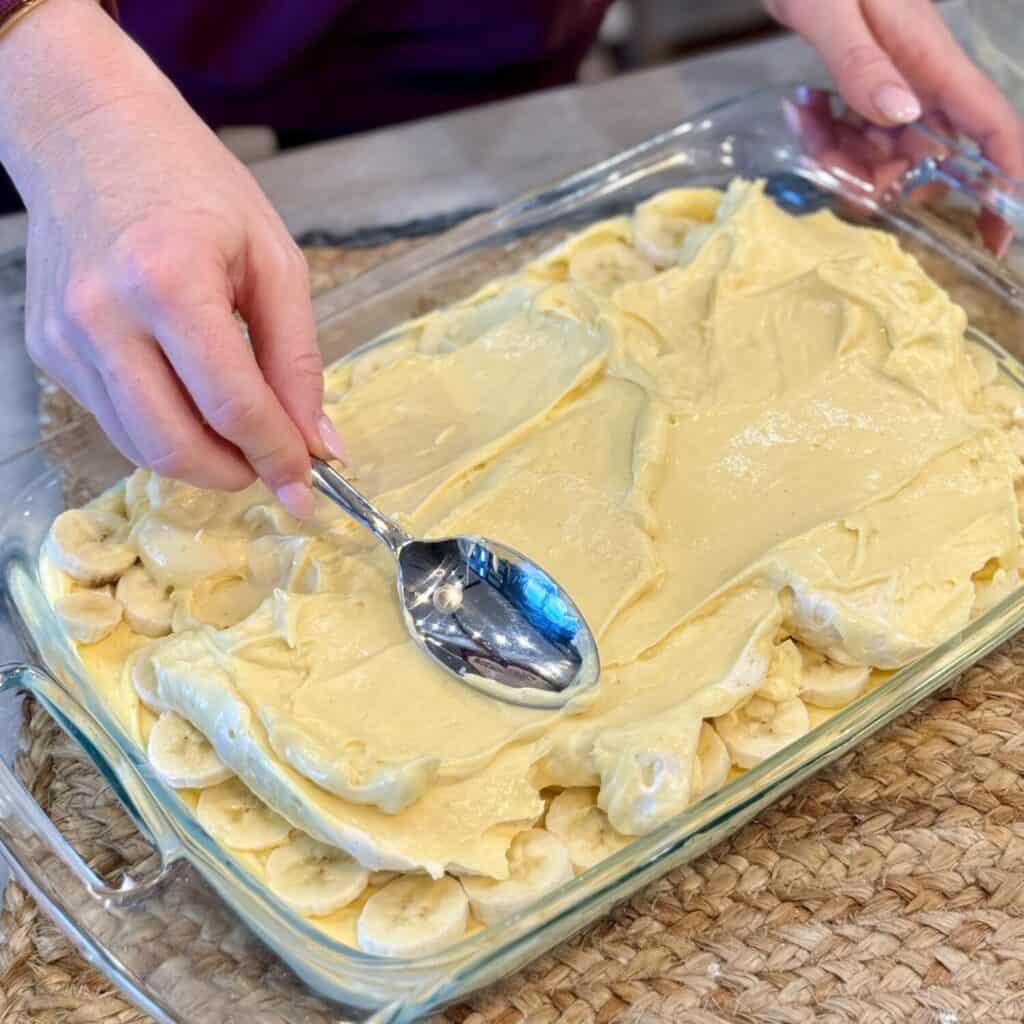Making layers of Chessman Banana Pudding.