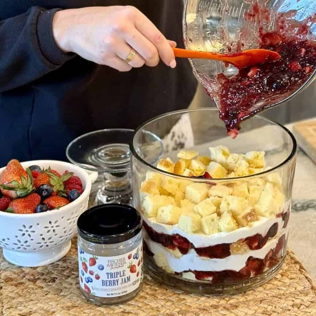 Assembling a berry trifle.