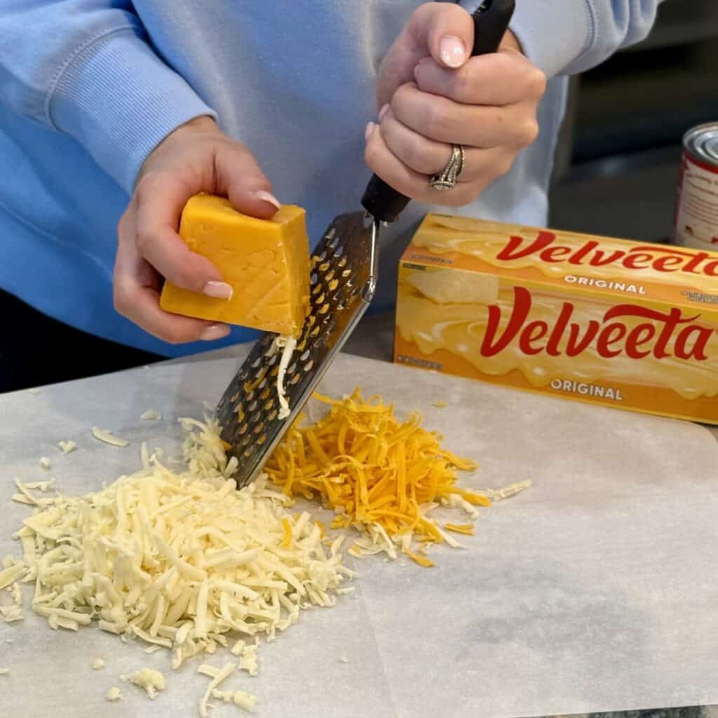 Shredding cheese.