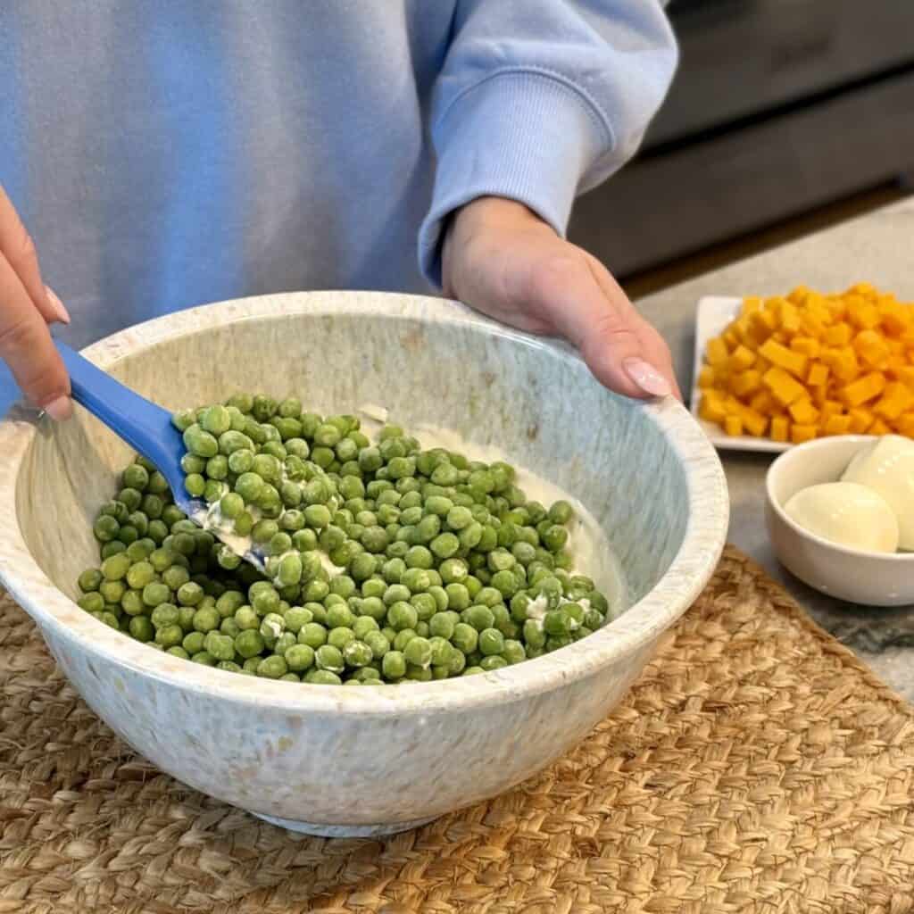 A bowl of pea salad.