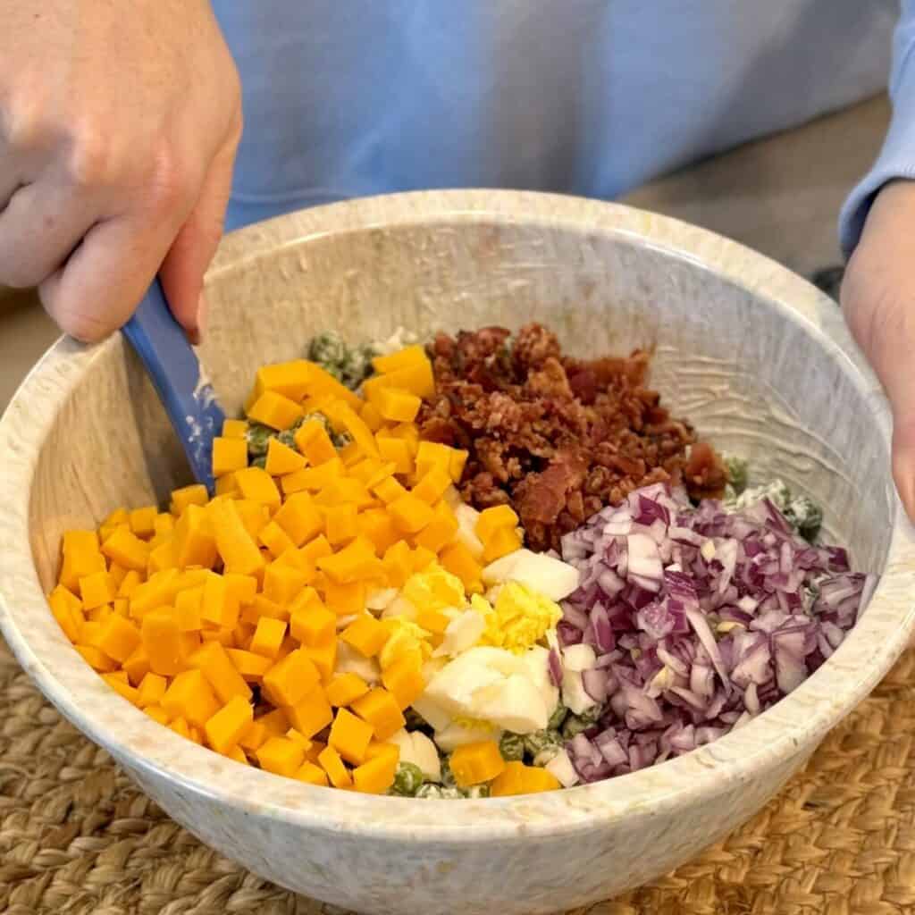 A bowl of pea salad.