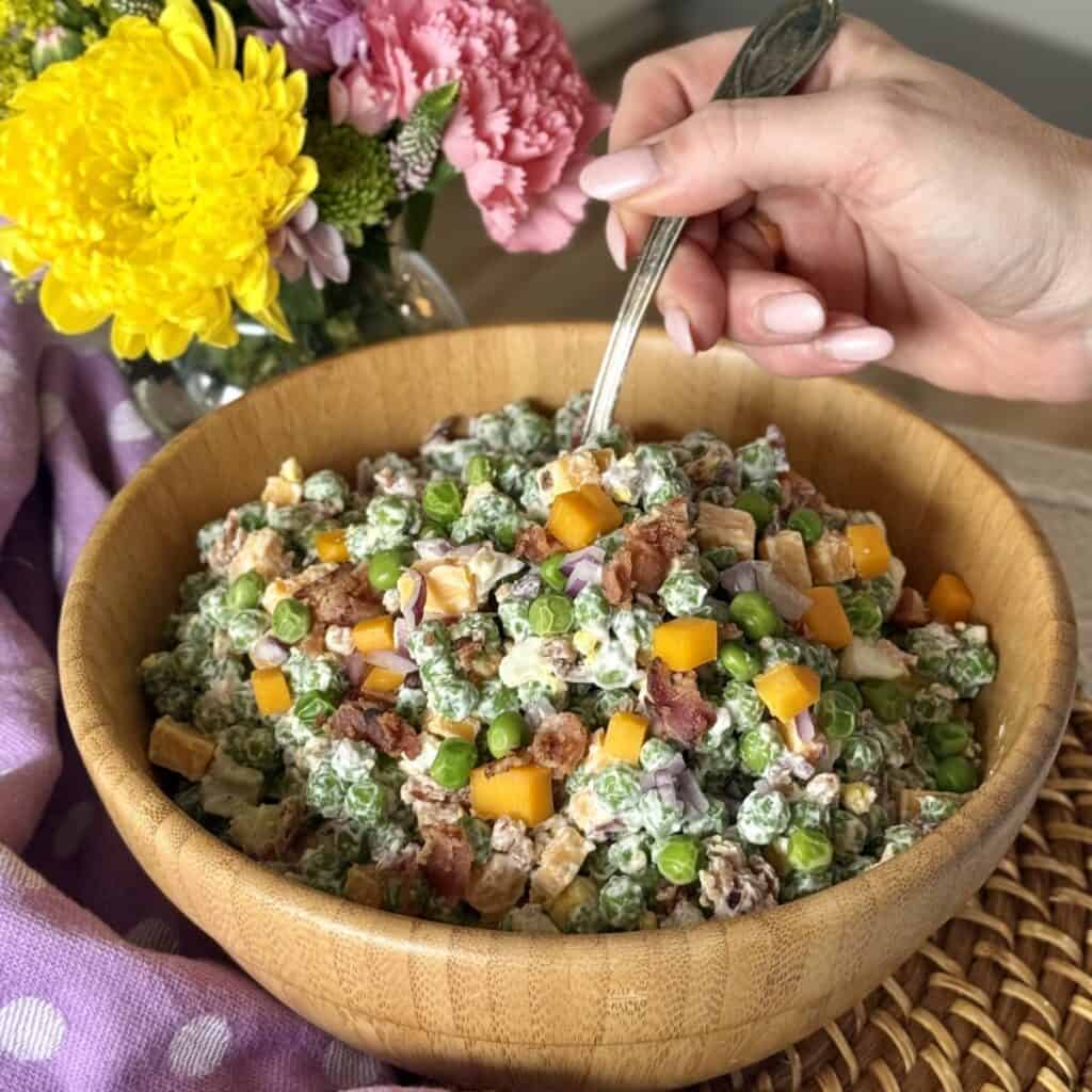 A bowl of pea salad.
