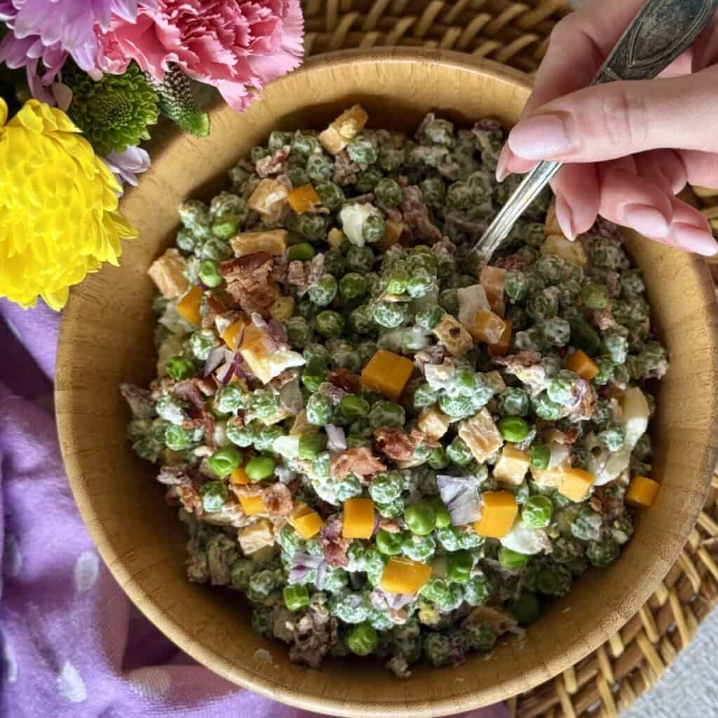 A bowl of pea salad.