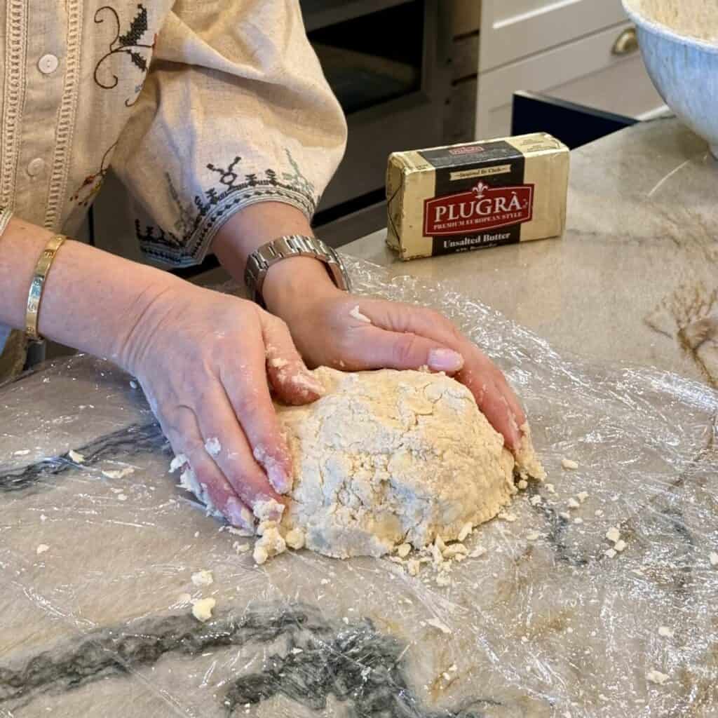 Preparing a pie crust to put in the freezer.