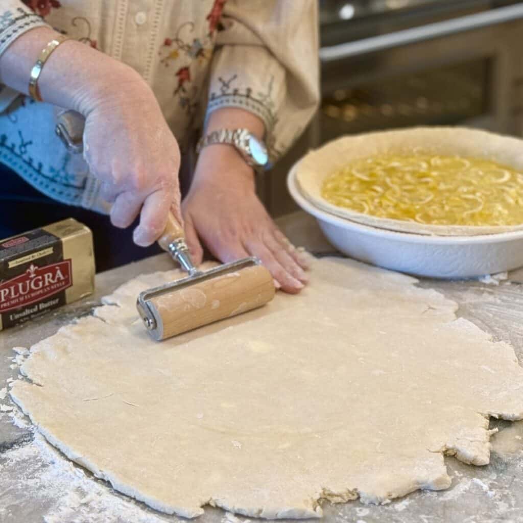 Rolling a pie crust.
