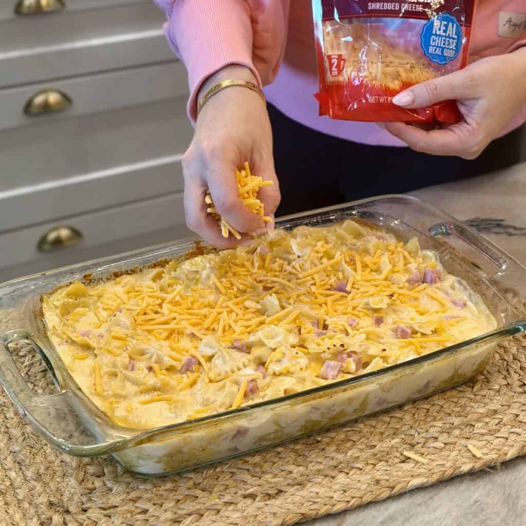 Mixing a Ham and Cheese Casserole in a pan.