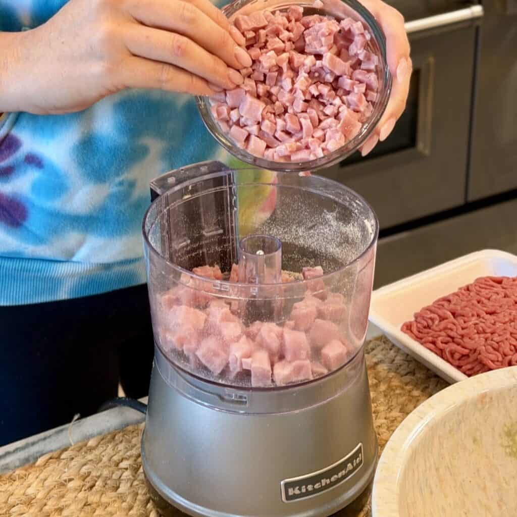 Grinding ham in a food processor.