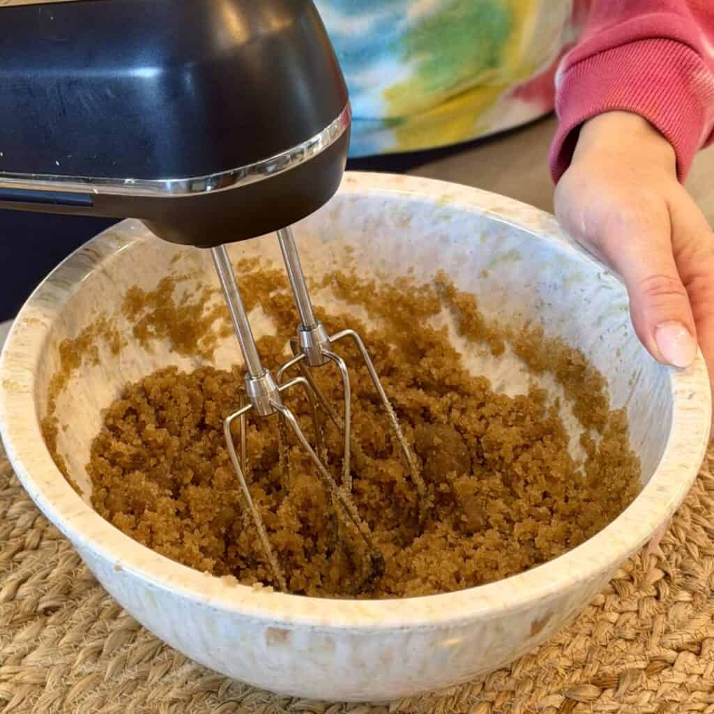 Mixing sugar and butter.