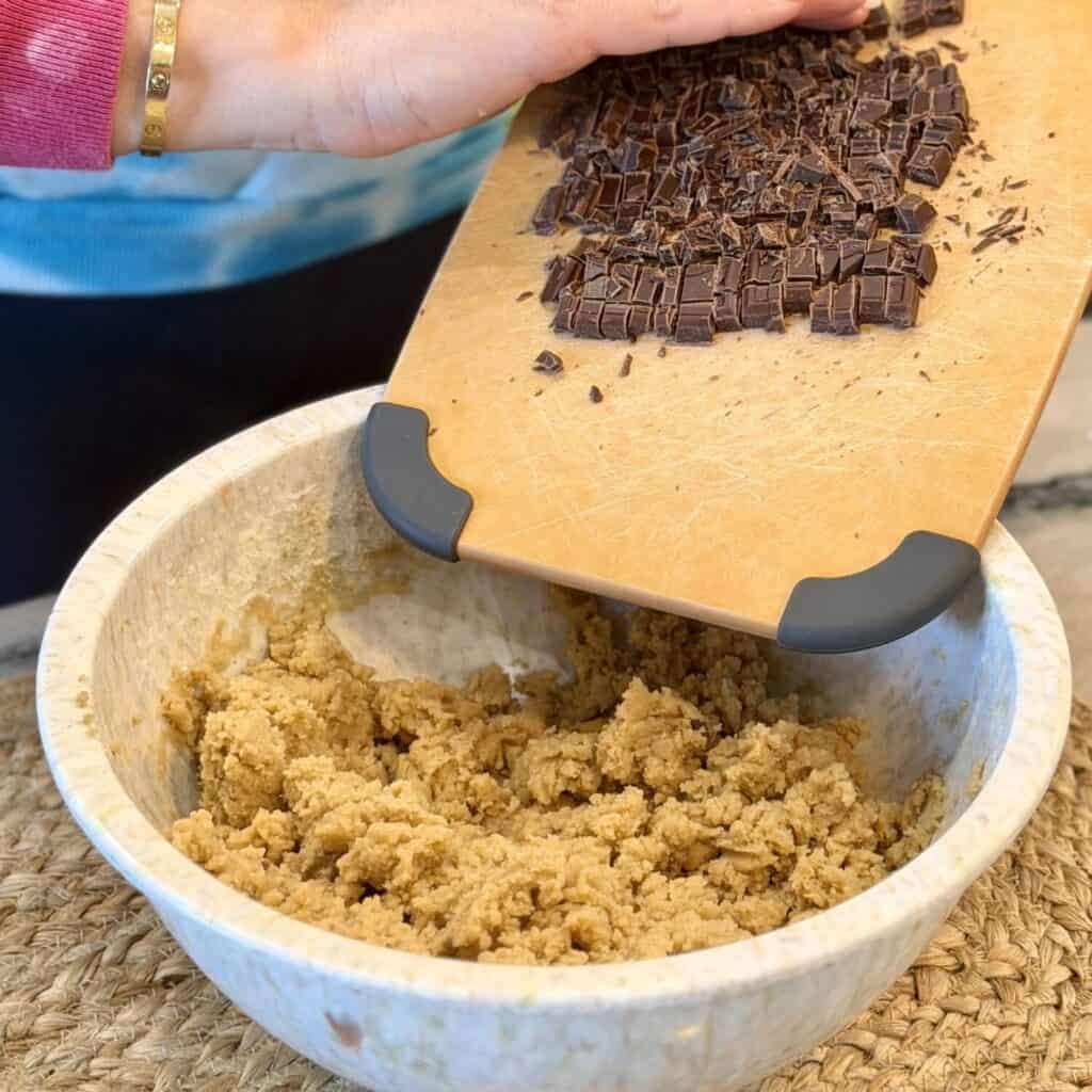 Adding chocolate to the dough.