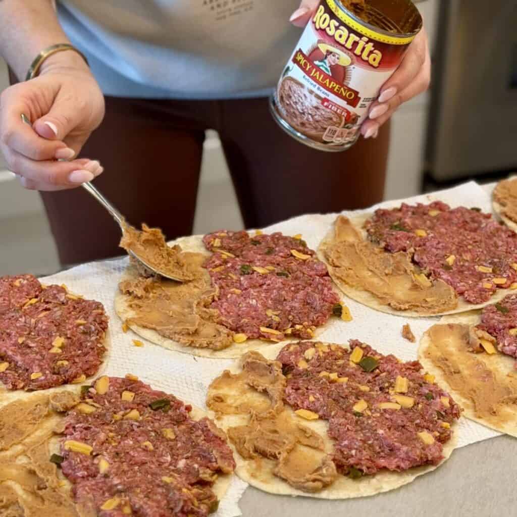 Assembling sheet pan tacos.
