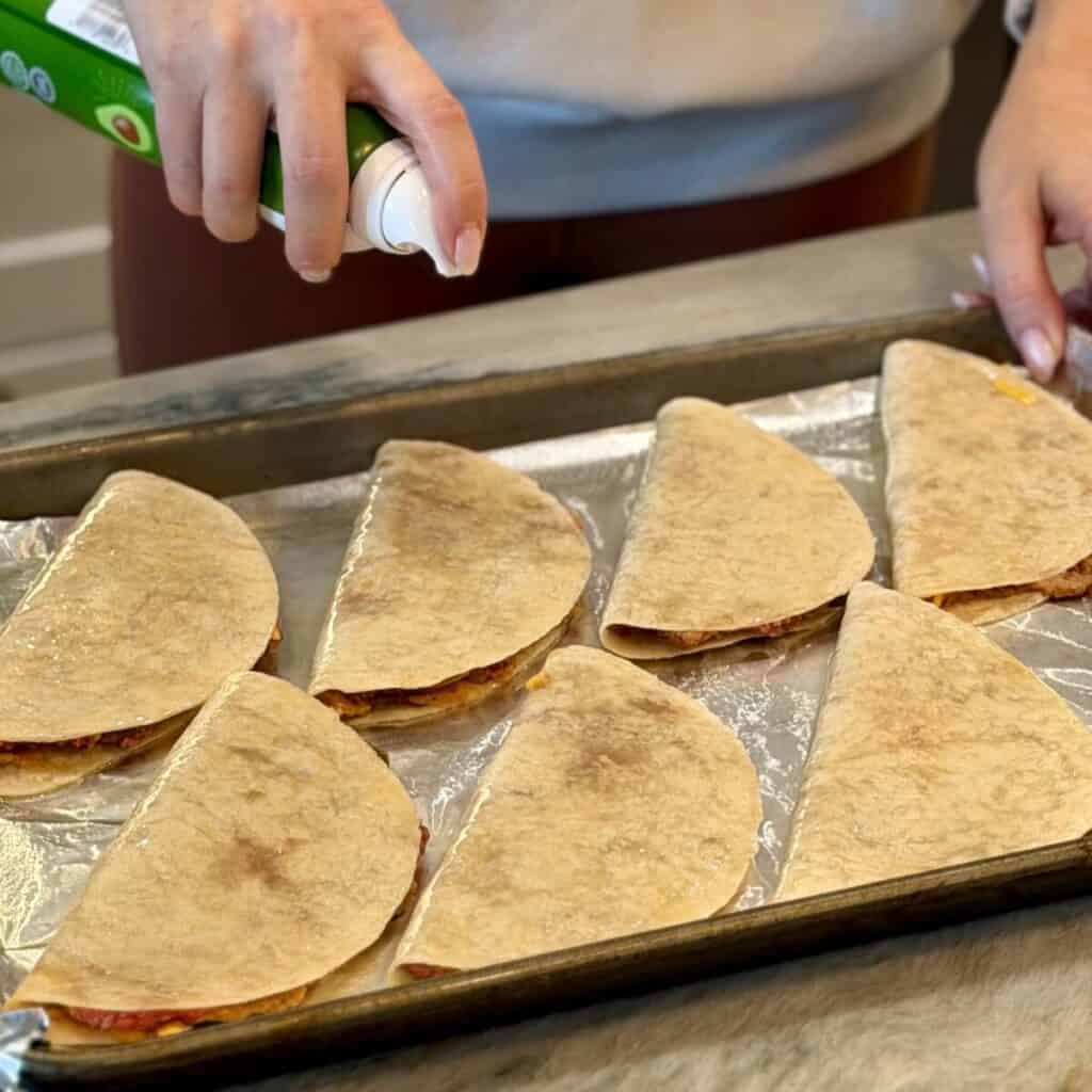 Assembling sheet pan tacos.