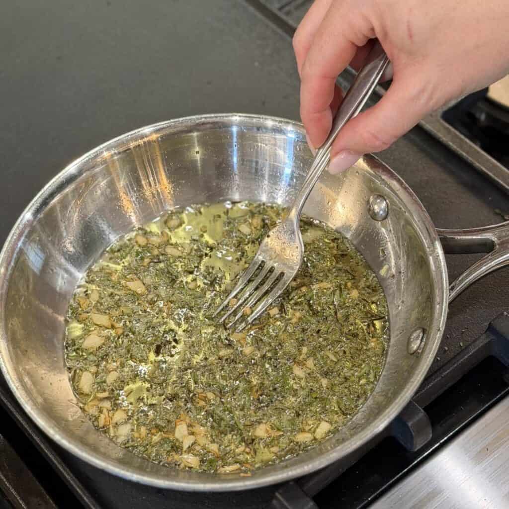 Rosemary garlic oil in a skillet.