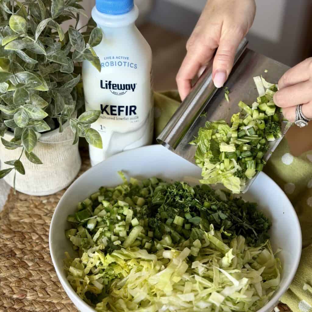 A bowl of green goddess salad.