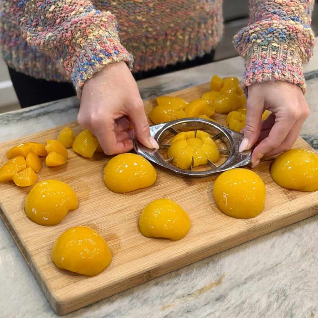 Slicing the peaches into bite size pieces.
