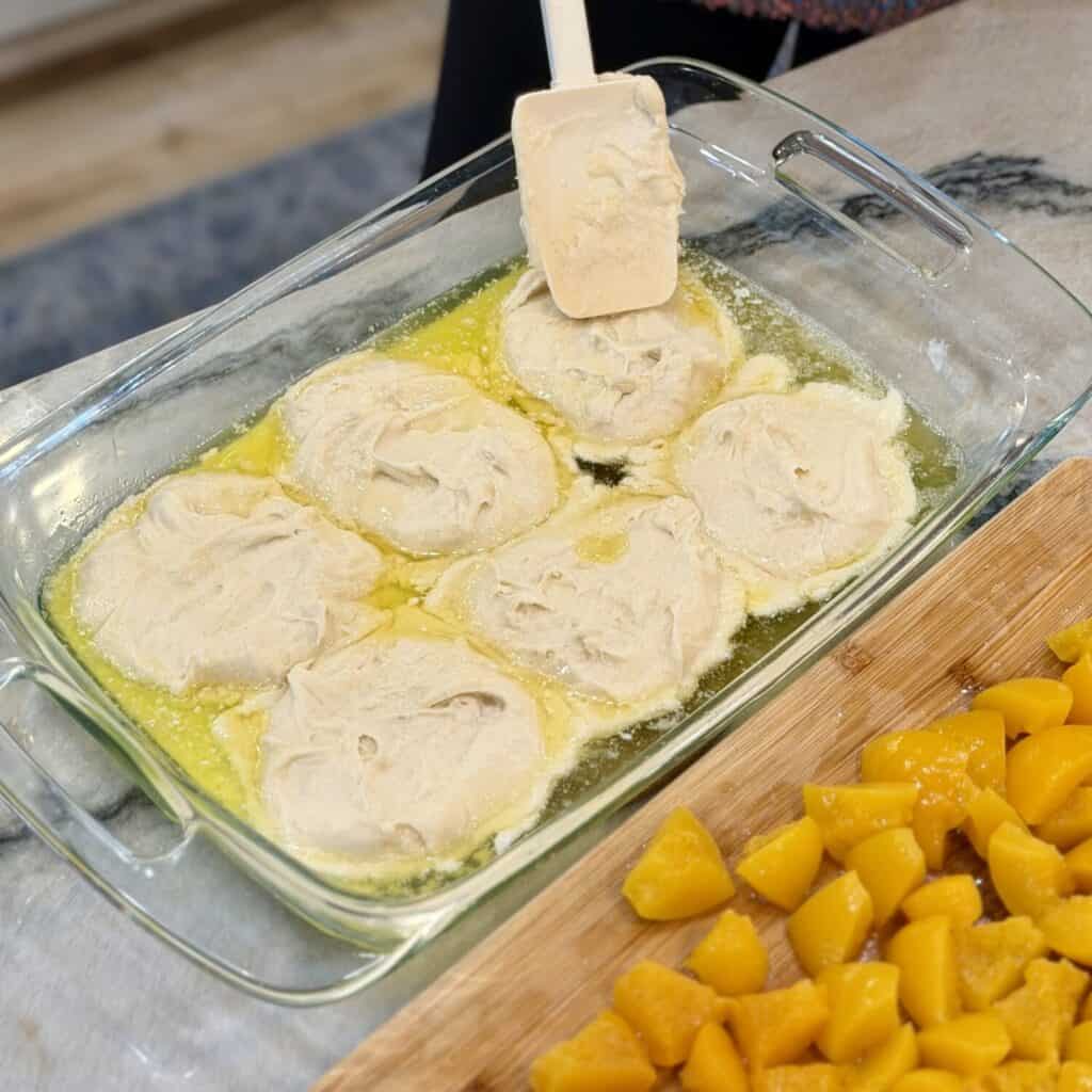 Spreading dough into a flat layer.