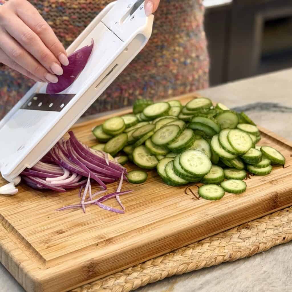 Slicing red onions for salad.