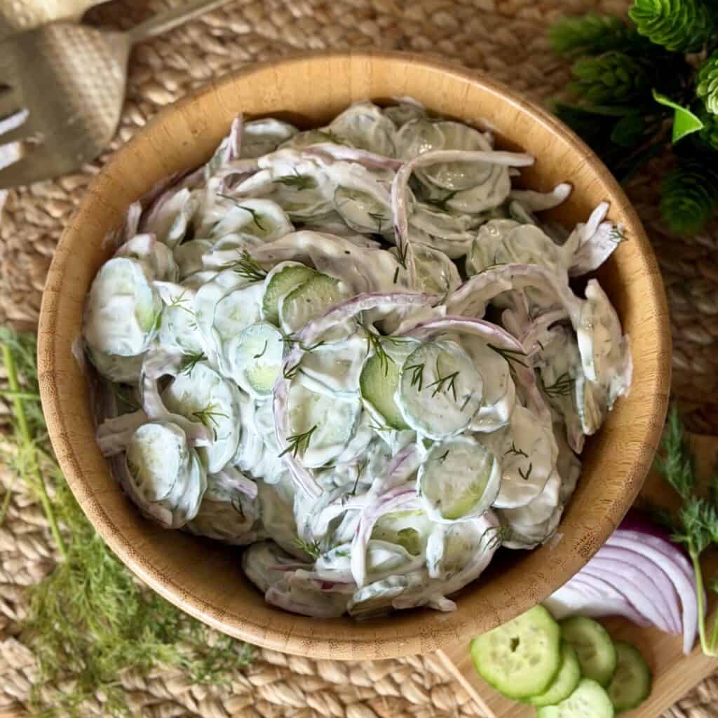 A bowl of Creamy cucumber salad.