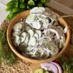 A bowl of Creamy cucumber salad.