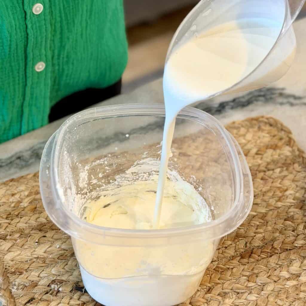 Adding cream to container for Whipping cream.