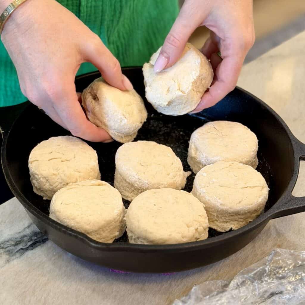 Adding lard biscuits to cast iron.