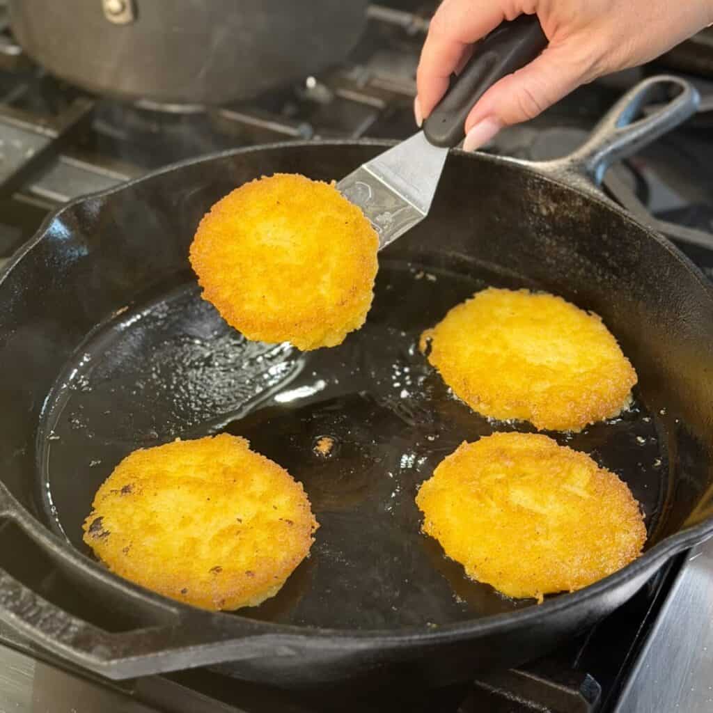 Frying the cornbread in the pan.