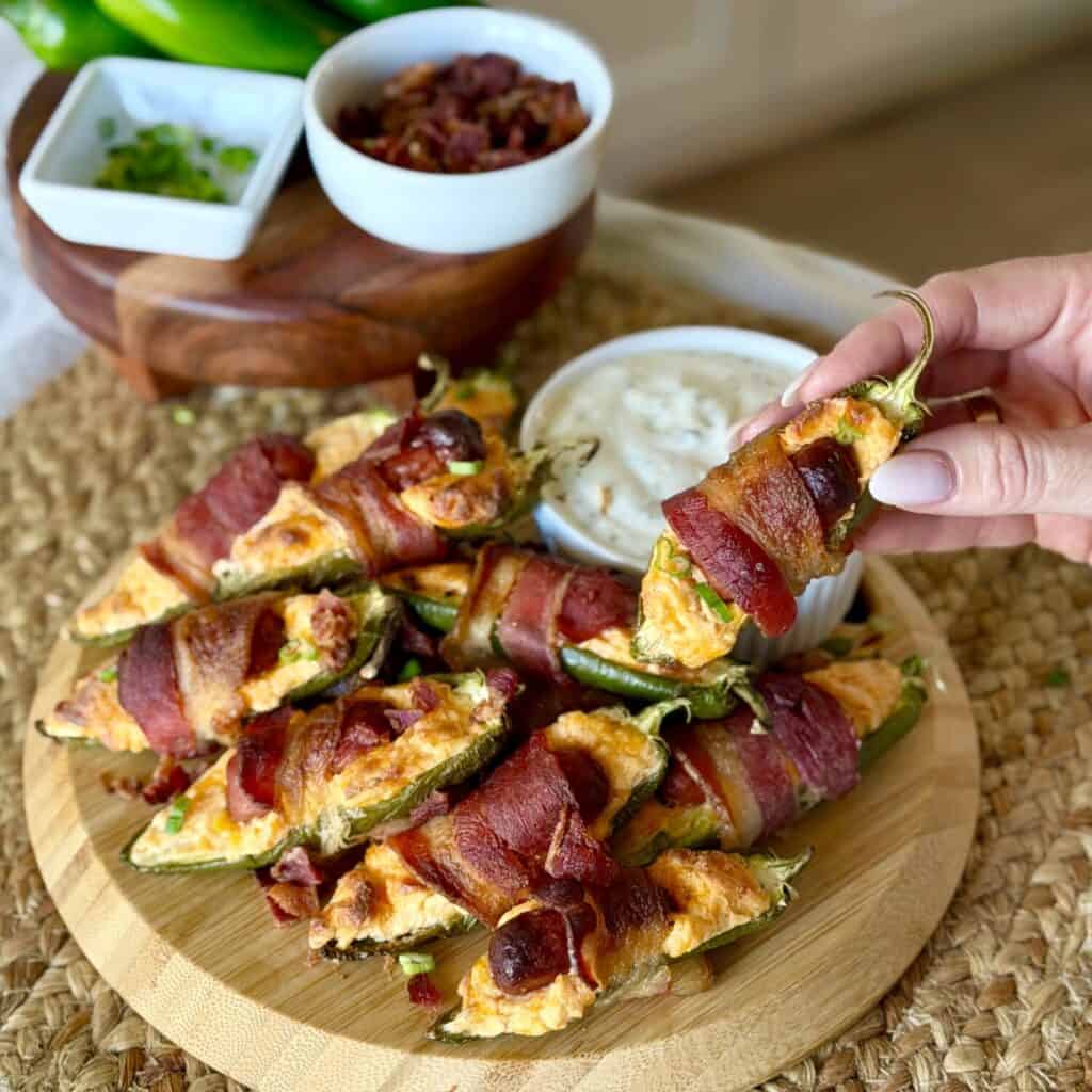 A plate of Bacon wrapped jalapeño poppers.