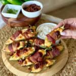 A plate of Bacon wrapped jalapeño poppers.
