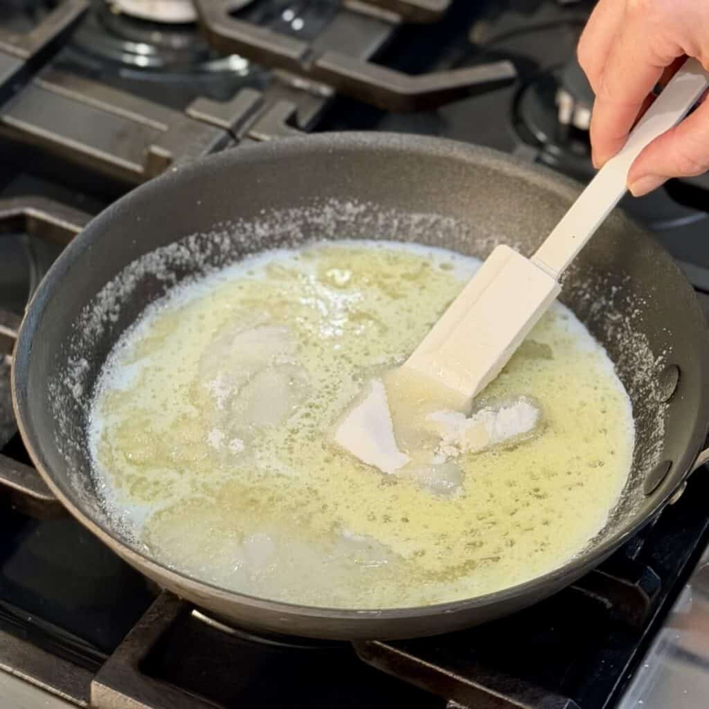 Heating sugar and butter in the pan.