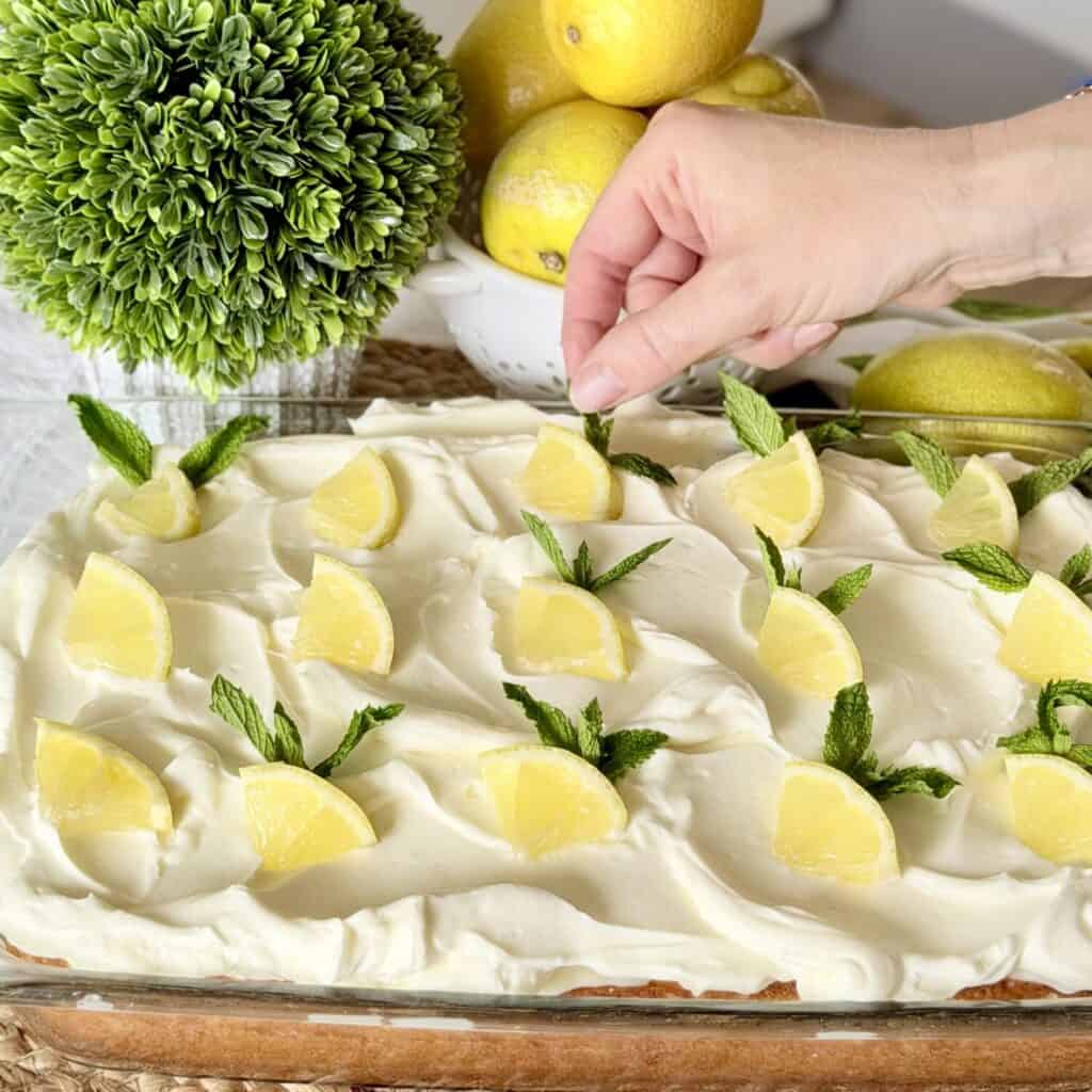 Adding mint to the lemonade cake.