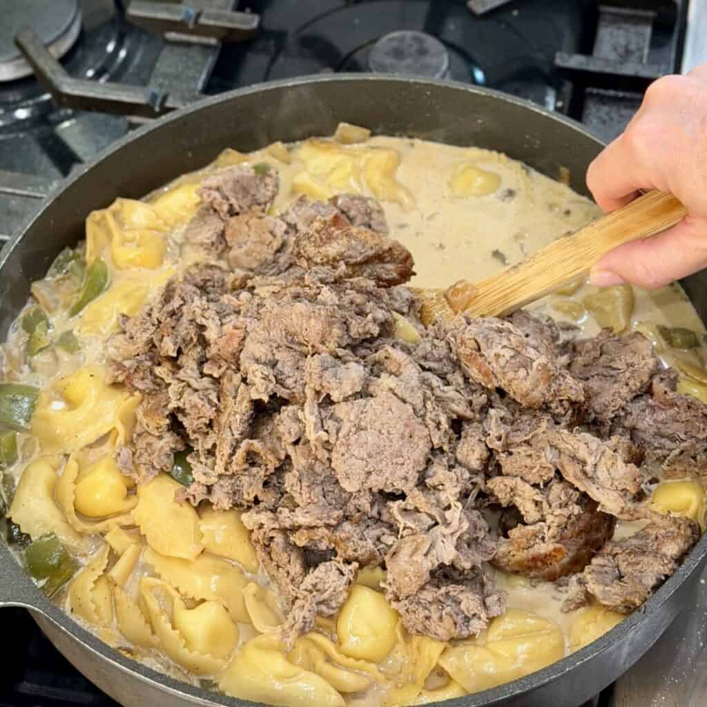 Combining beef into the Pot.